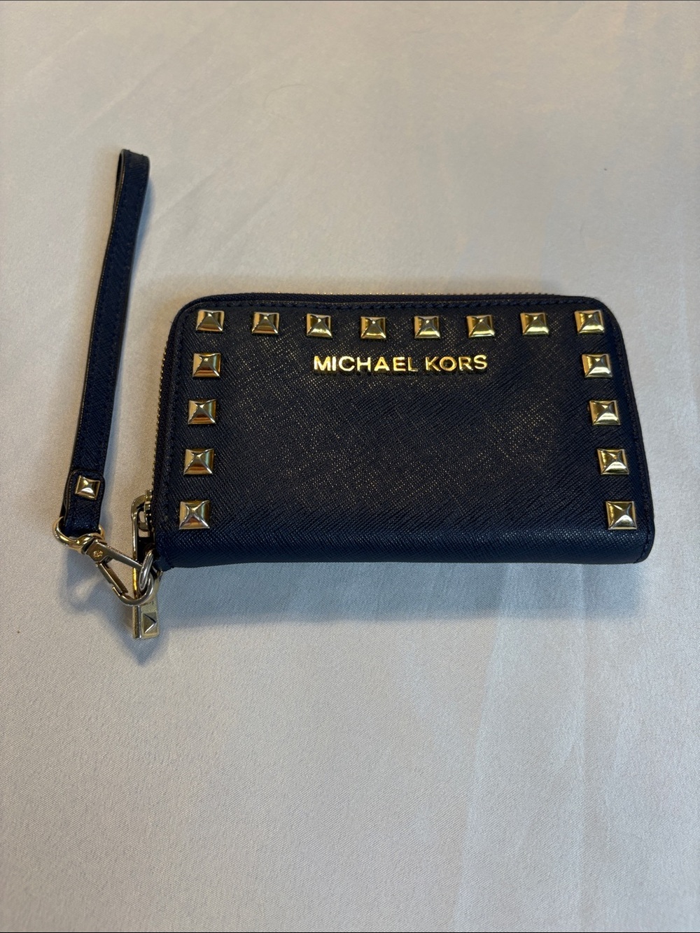 Michael Kors Navy Wristlet with Gold Stud Accents